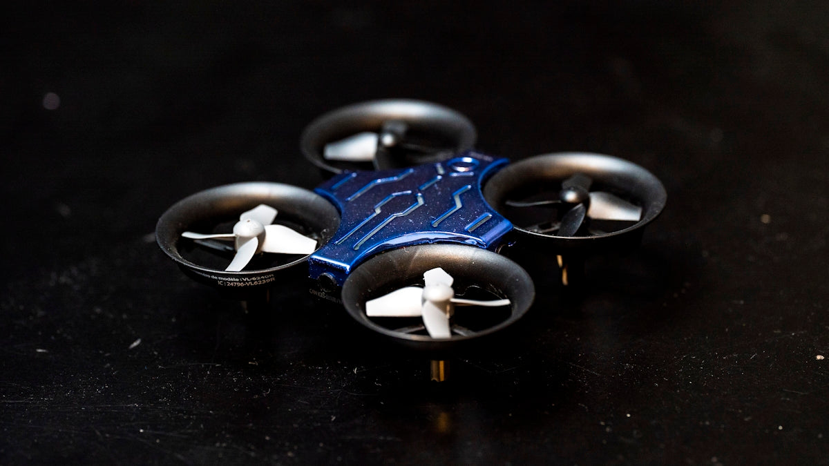 a close up of a remote control device on a table