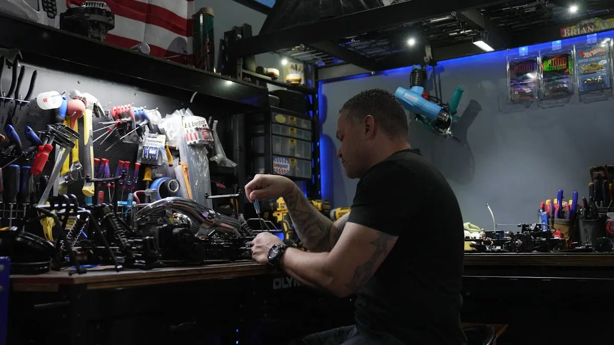A man sitting at a bar working on a machine