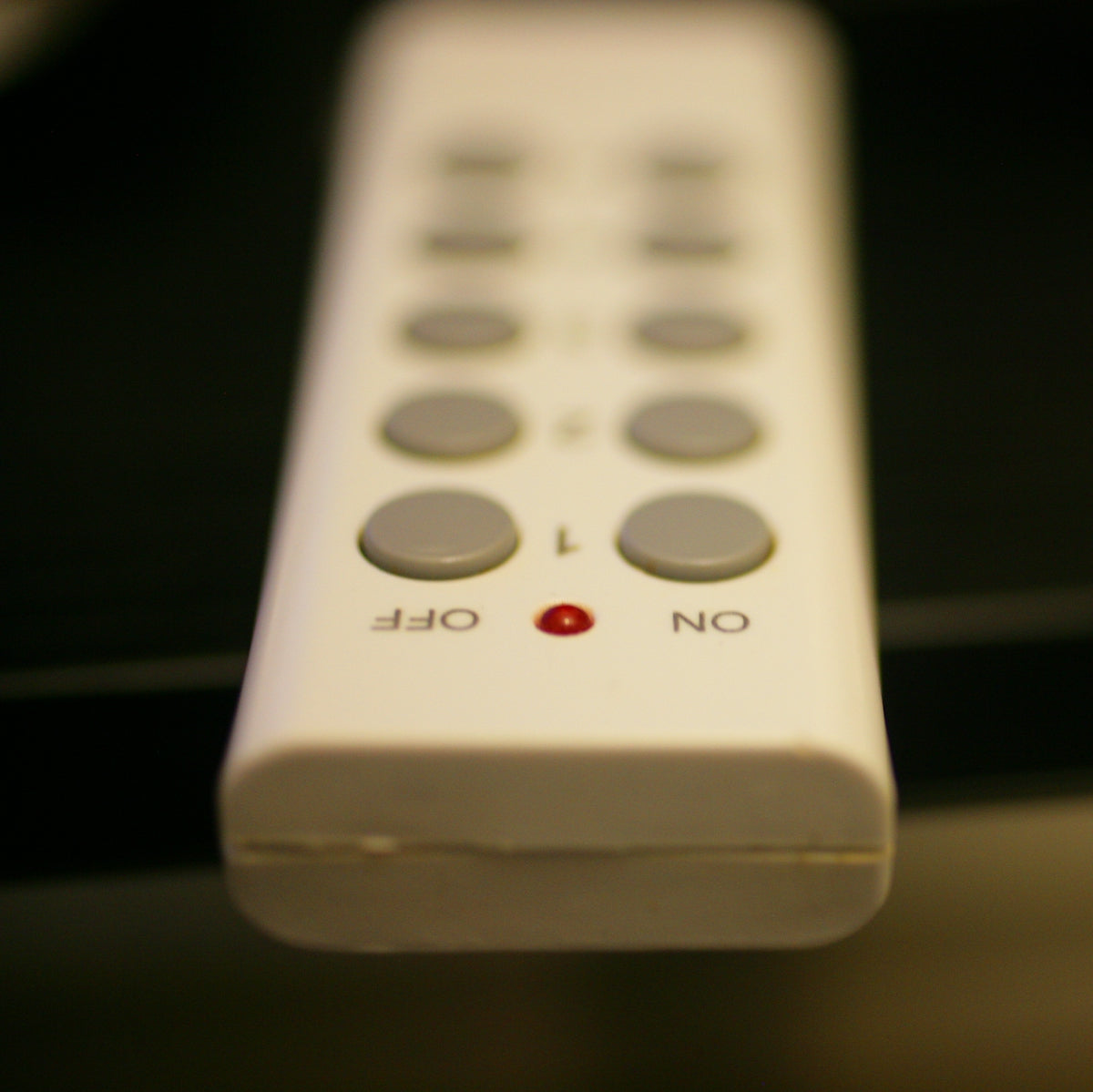 Remote control with buttons labeled off and on.