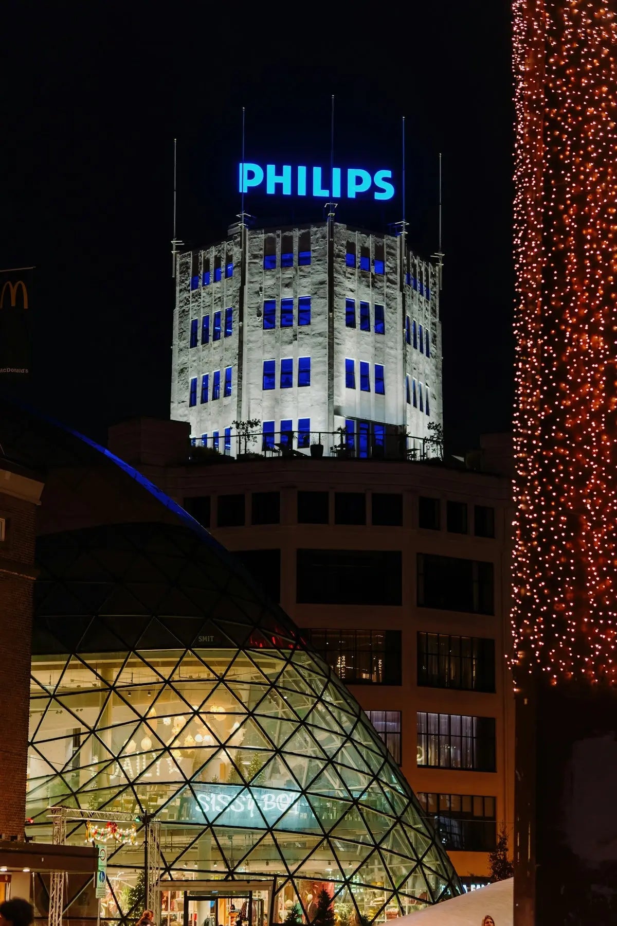 Philips building illuminated at night with christmas lights