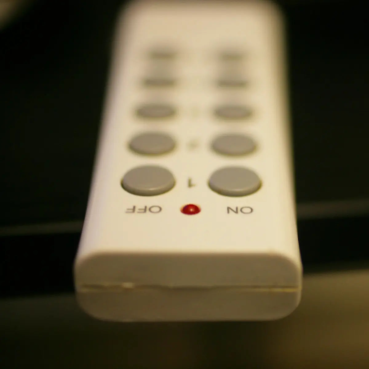 Remote control with buttons labeled off and on.